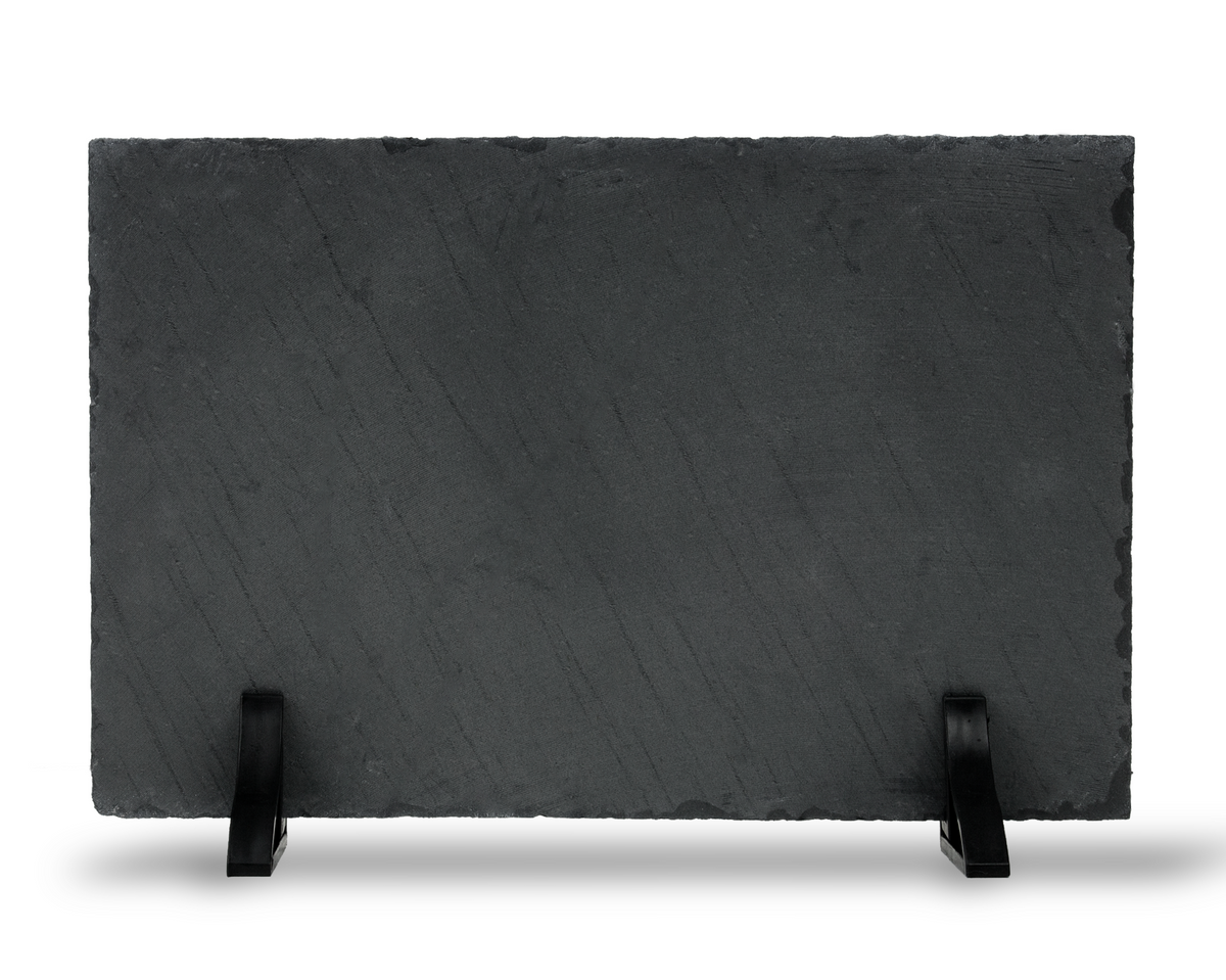 Unprinted reverse side of a rectangular natural slate plaque supported by two black display stands