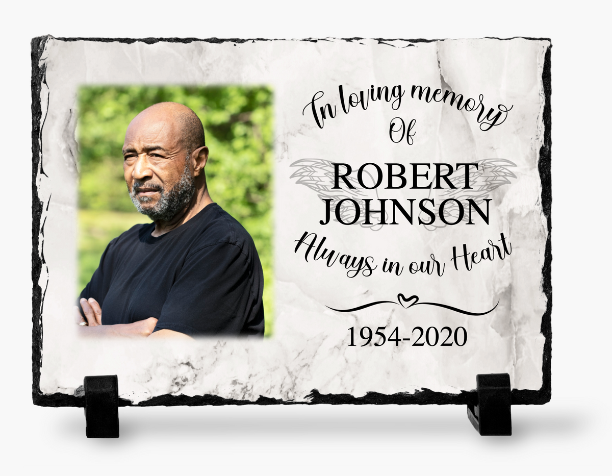 Memorial photo slate with a man’s portrait, marble-look print, In Loving Memory wording, sample name and dates, and stands