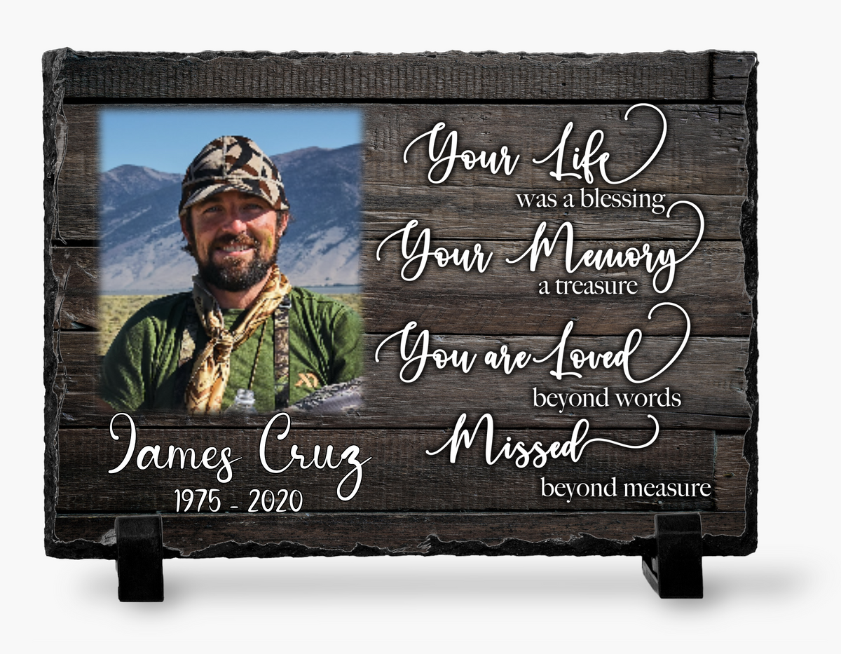 Dark wood-look Your Life, Your Memory memorial photo slate with a man's portrait, white tribute wording, personalized name, dates and black stands.